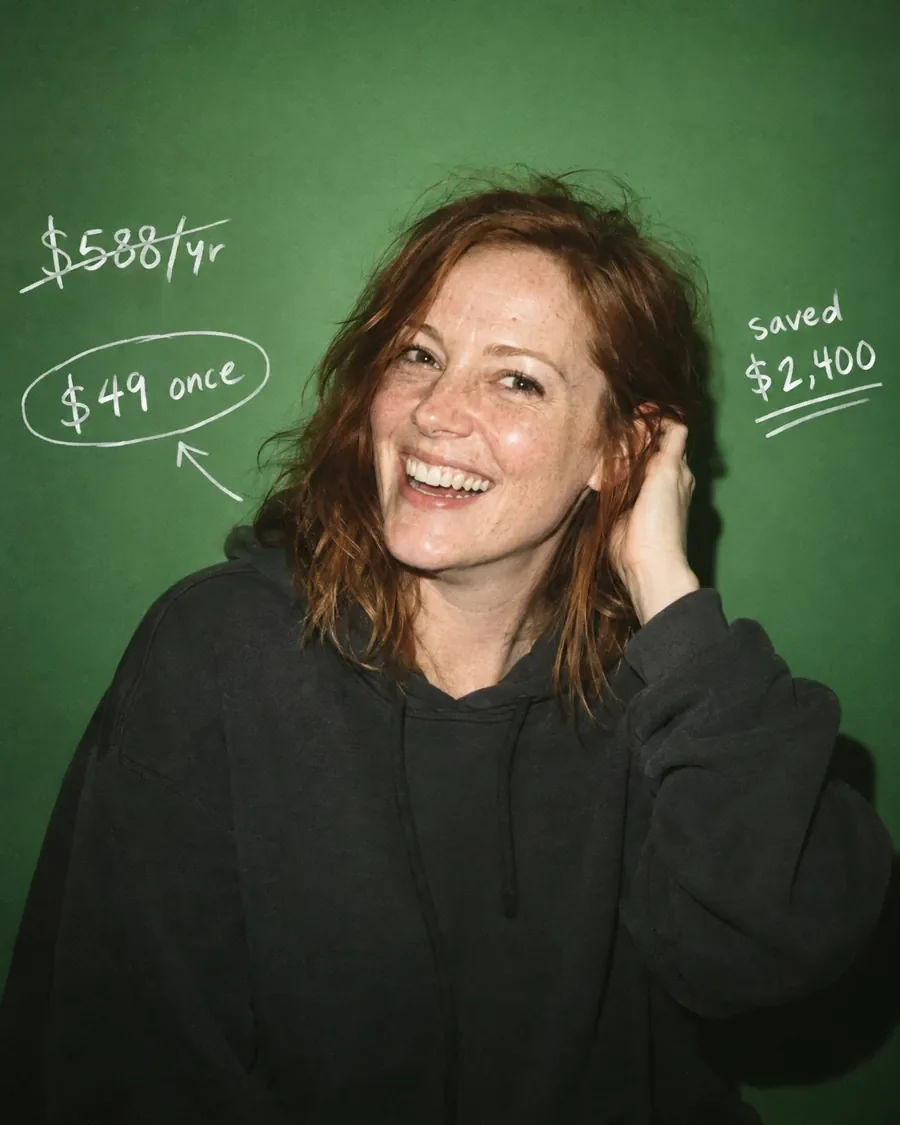 A laughing founder tucks her hair back next to a doodle: $588 a year crossed out, $49 once circled.
